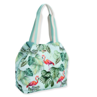 side view of a crescent-shaped mint canvas hobo bag featuring a flamingo and tropical leaf print with cream fabric handles.