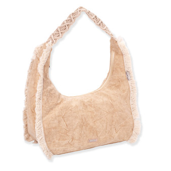 Three-quarter view of a crescent-shaped tan fabric hobo bag featuring vertical cream fringe trim and a braided macramé shoulder strap.
