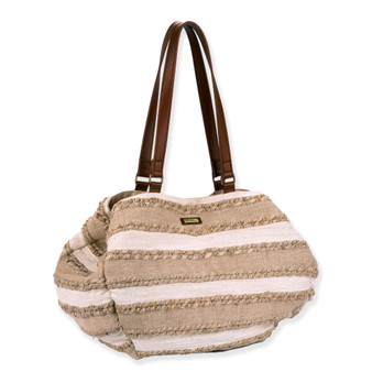 Three-quarter view of a slouchy cream and tan striped straw shoulder bag featuring horizontal fringe rows and brown leather handles.