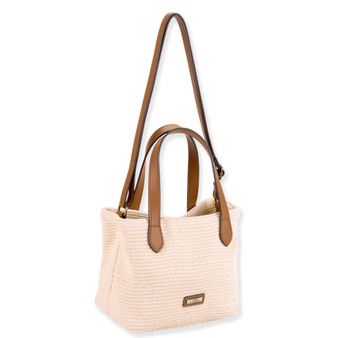 Front view of beige woven handbag with brown leather handles, long shoulder strap, structured tapered shape, and small bottom center label accent.