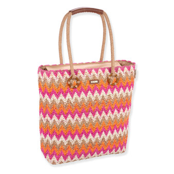 side view of colorful zigzag tote with pink, orange, white, beige pattern, tan handles with circular accents, and small top brand tag.