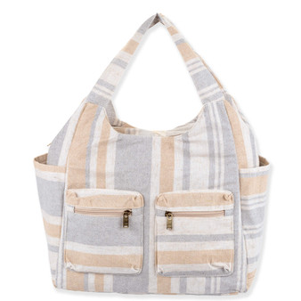 Front view of neutral striped canvas hobo tote, two zippered front pockets, antique brass hardware, and side slip pockets.