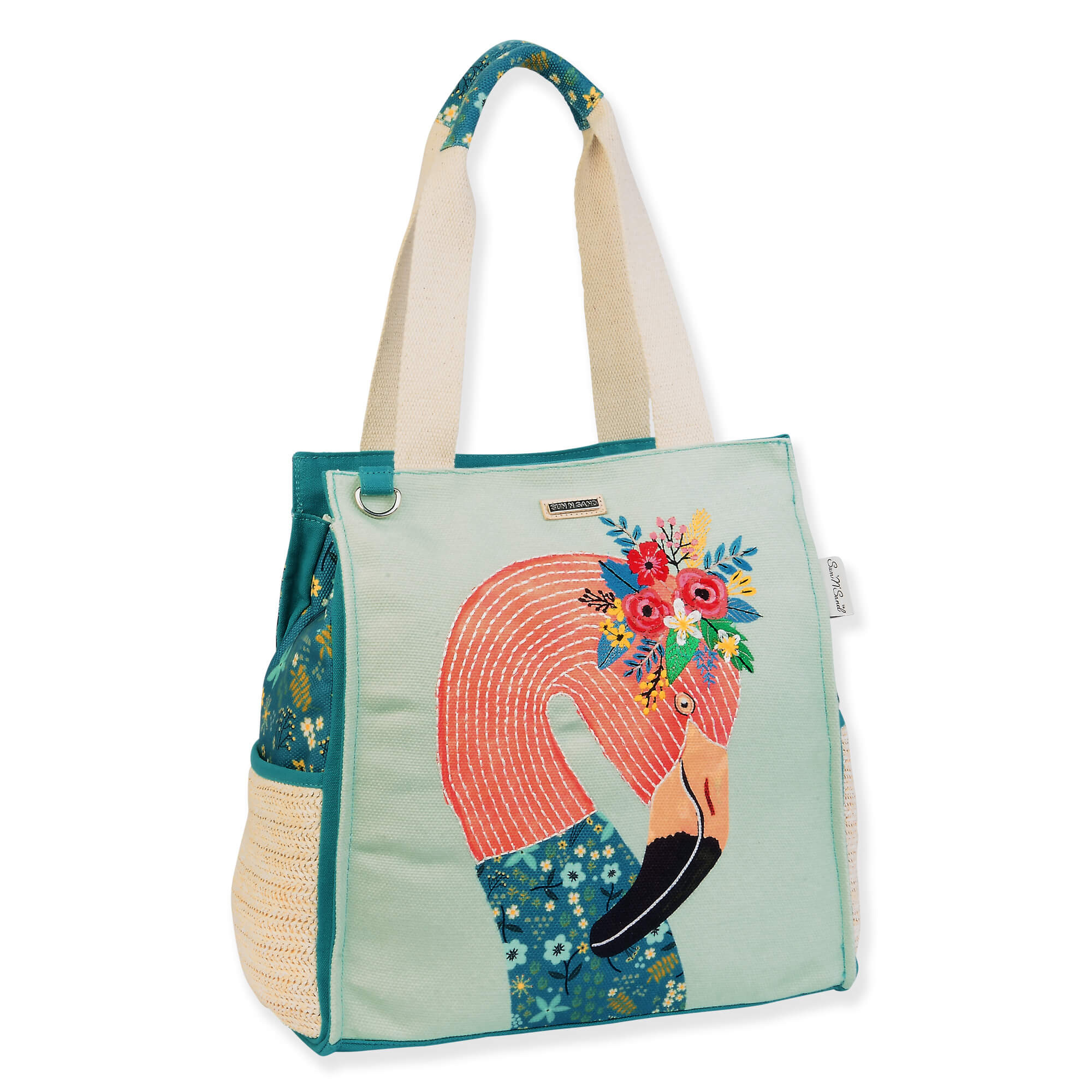 Canvas beach tote bag with illustrated bird and floral artwork panel, textured fabric sides, reinforced teal pockets, wide shoulder handles, angled side view