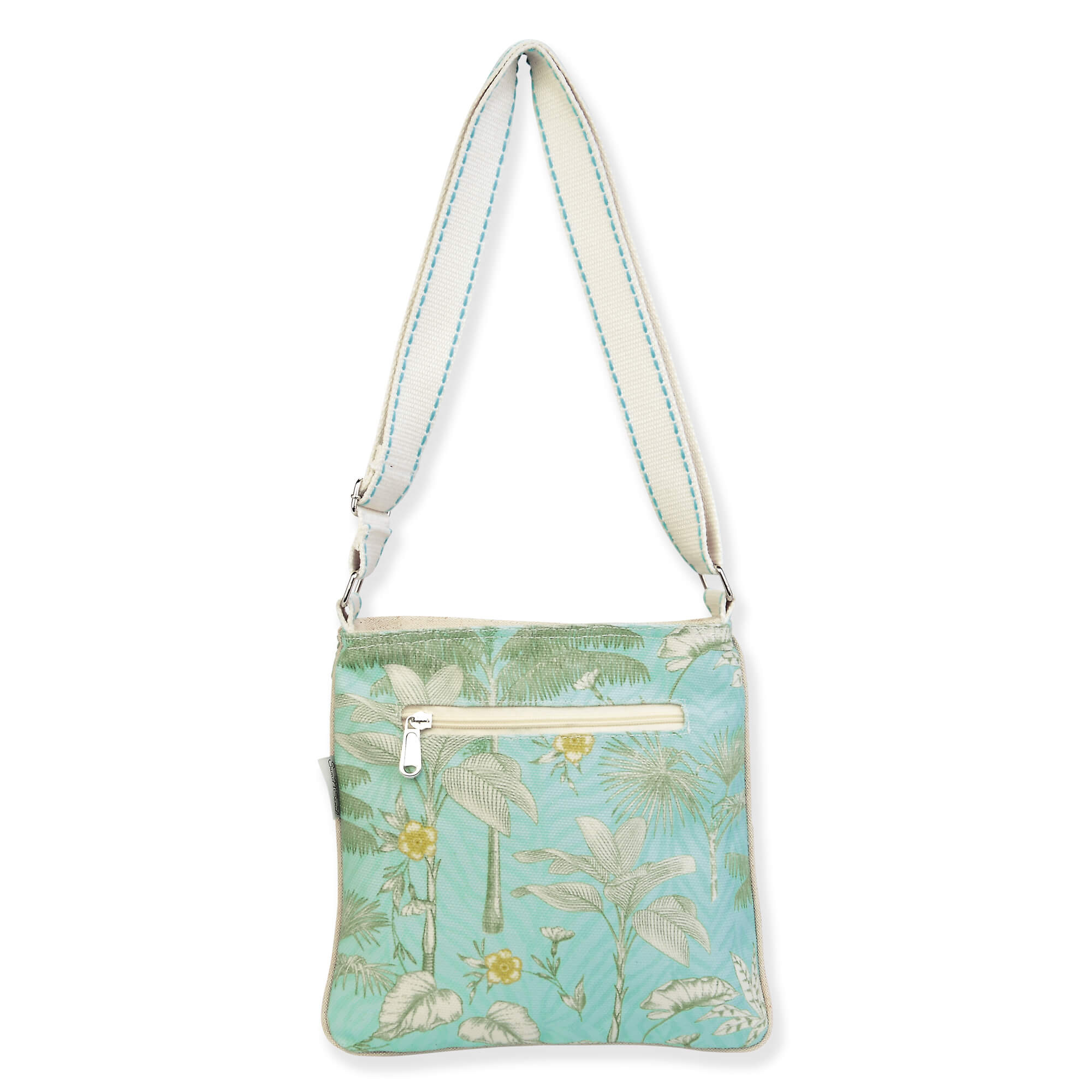 Canvas crossbody bag with tropical palm leaf print, smooth fabric backside, rear zippered pocket, adjustable light blue shoulder strap, back view shown