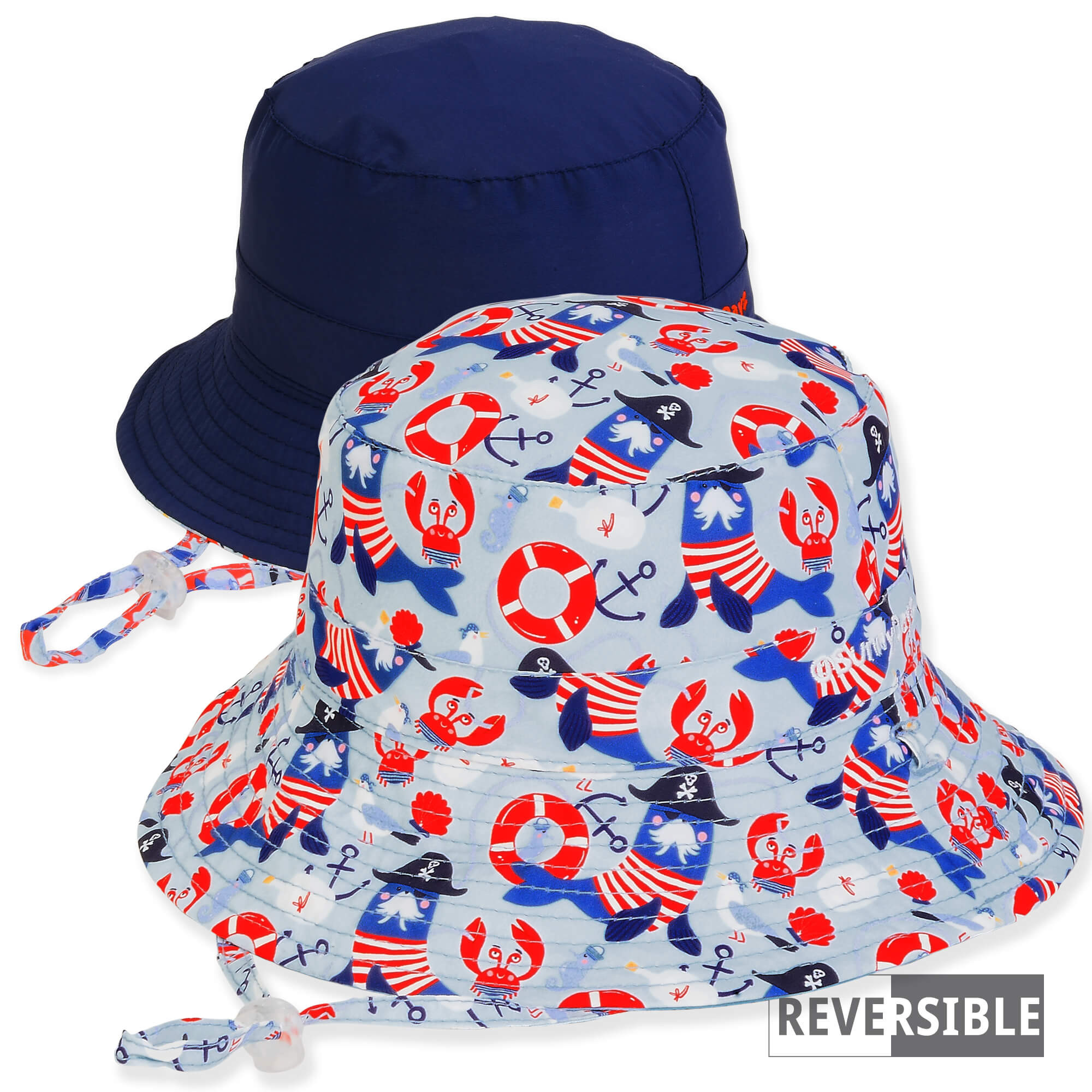 Three-quarter view of a reversible kids' bucket hat featuring a pirate-themed aquatic print side and a solid navy side.