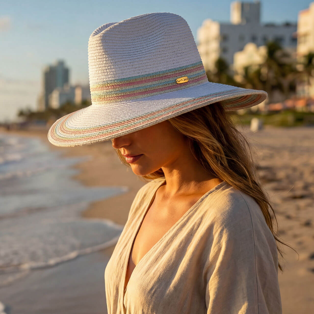 Lifestyle portrait of the Sun N Sand HH3505 Women’s Safari Hat in natural-toned woven straw, featuring a decorative braided rope hatband and a structured crown for an adjustable fit and UPF 50+ sun protection.