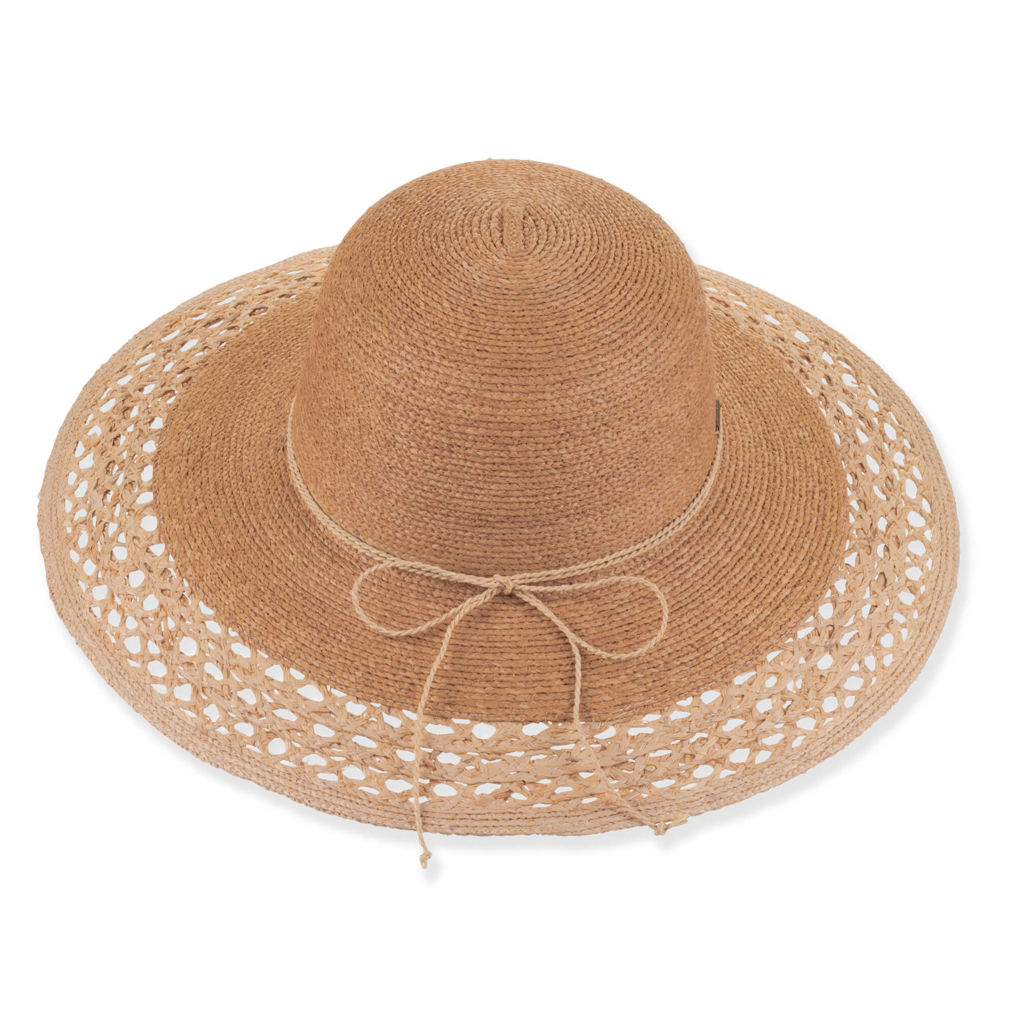 Three-quarter profile view of a black and tan woven straw floppy hat featuring a rounded crown, rope trim, and metal logo.
