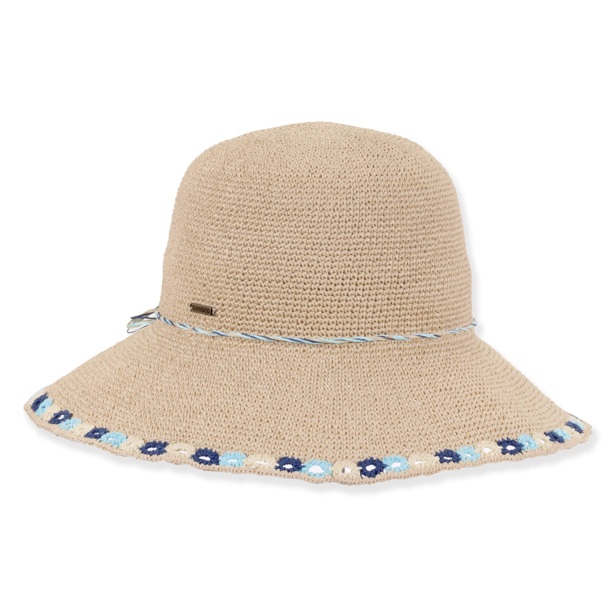 Three-quarter profile view of a tan crocheted bucket hat featuring a rounded crown, thin cord band, and blue floral-embroidered brim.