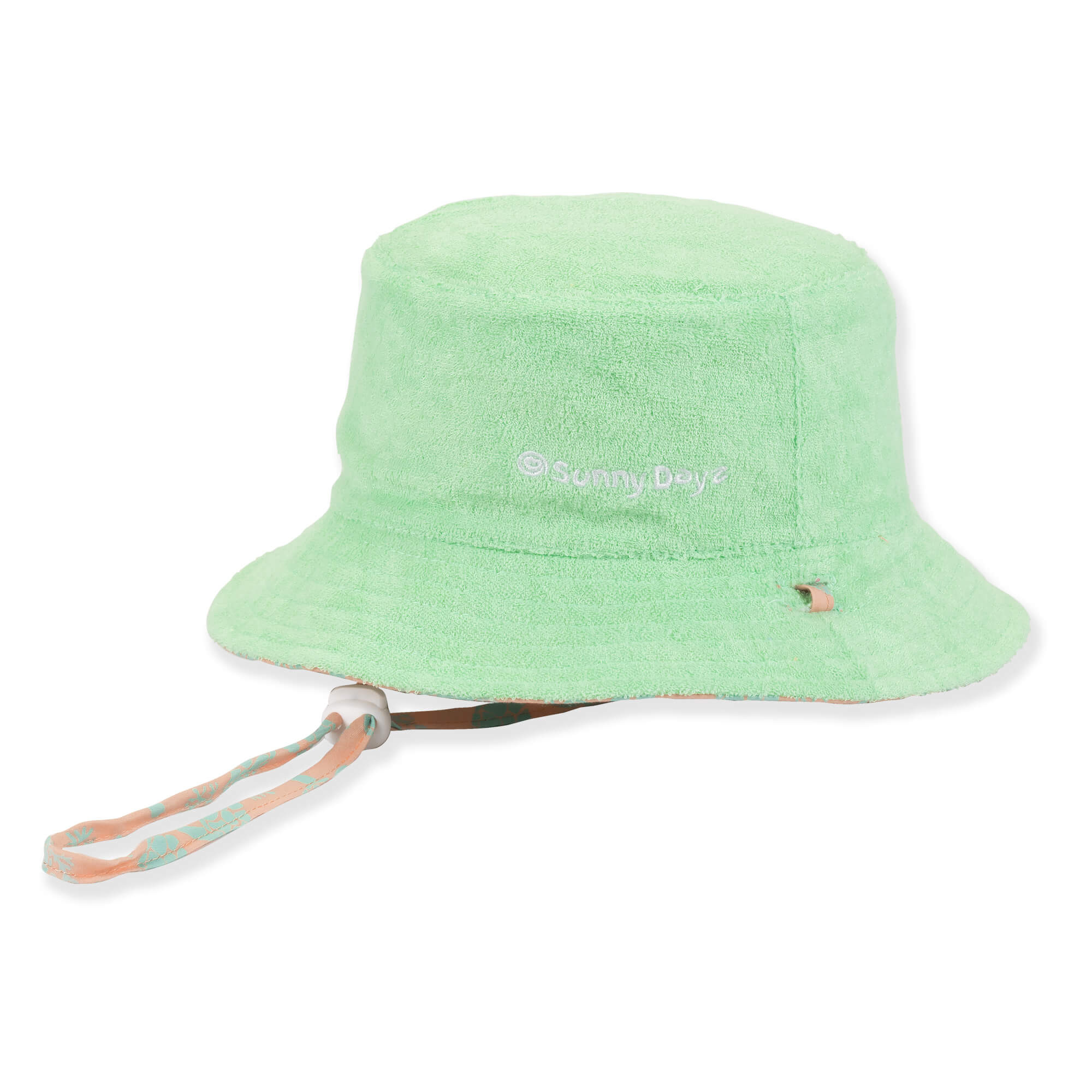 Three-quarter view of a light green terry cloth bucket hat featuring an adjustable chin strap with a white plastic toggle.