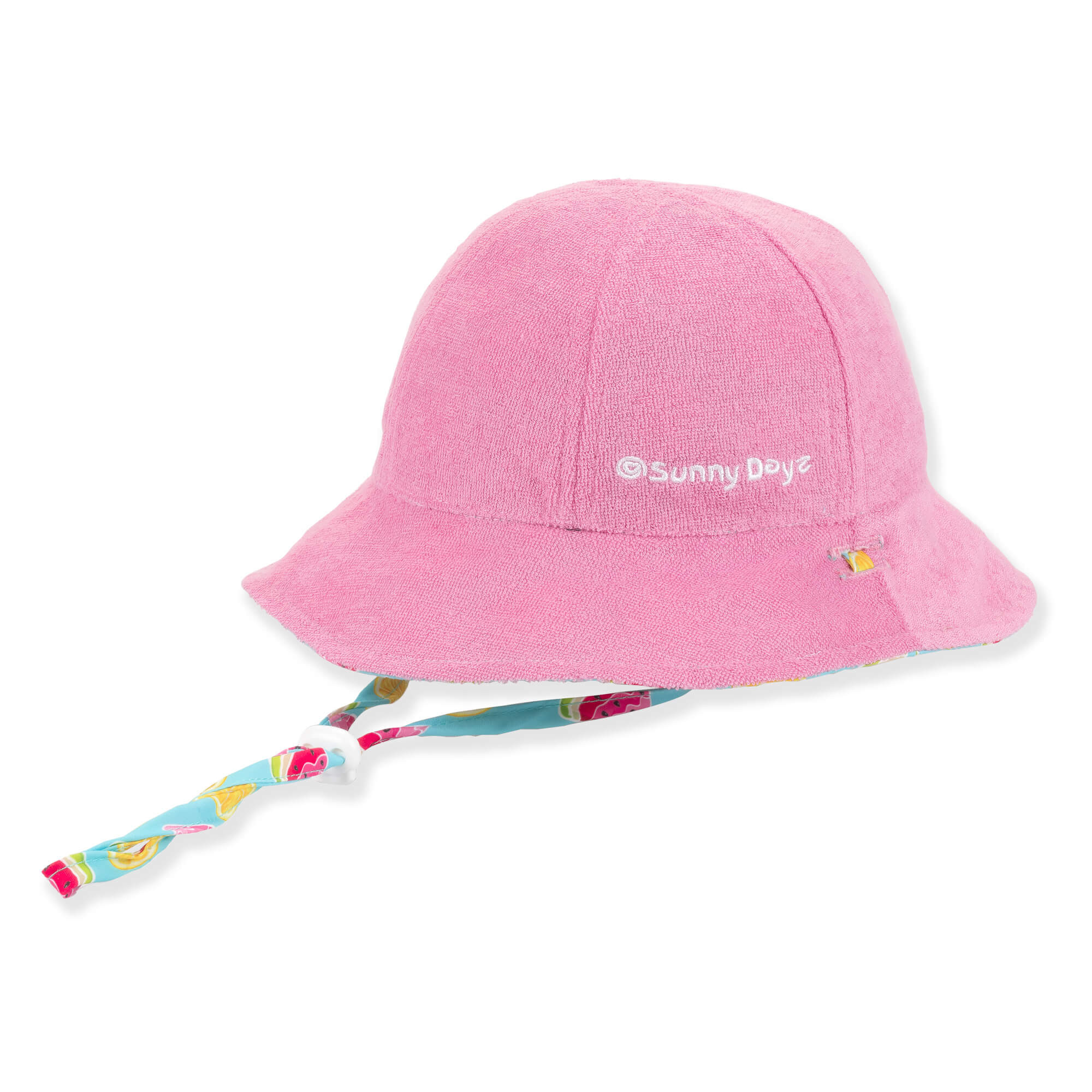 Three-quarter view of a bright pink terry cloth bucket hat featuring an adjustable patterned chin strap with a white toggle.