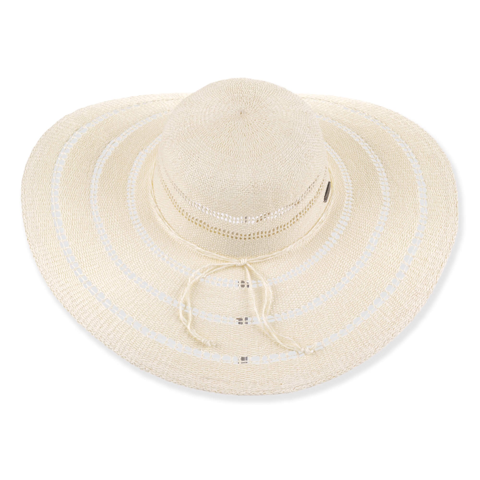 Three-quarter profile view of a cream-colored, crocheted straw floppy hat featuring a wide, scalloped brim and ventilated crown with metal logo.