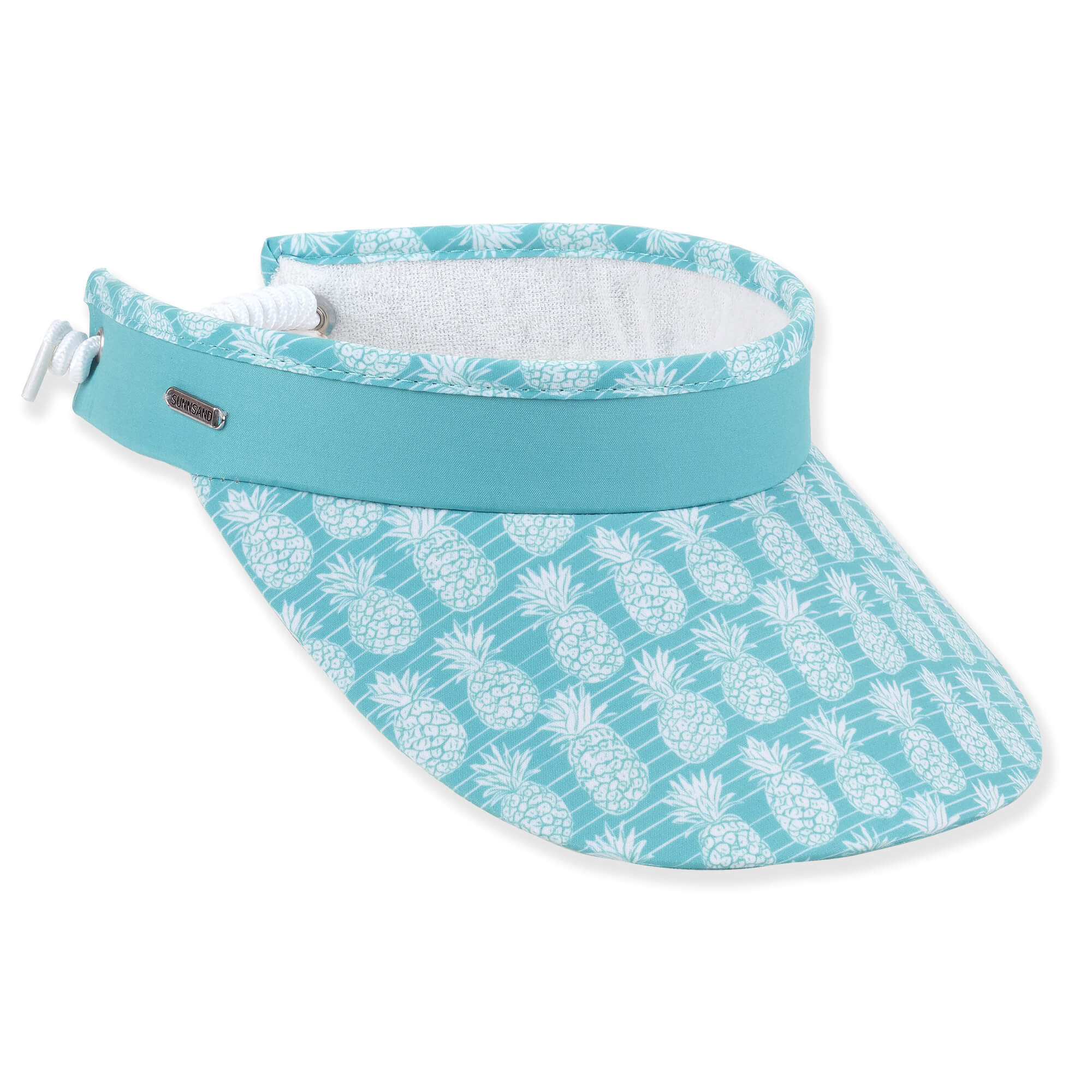 Three-quarter view of an aqua performance visor featuring a white pineapple print brim, white coiled elastic strap, and silver logo-plate.