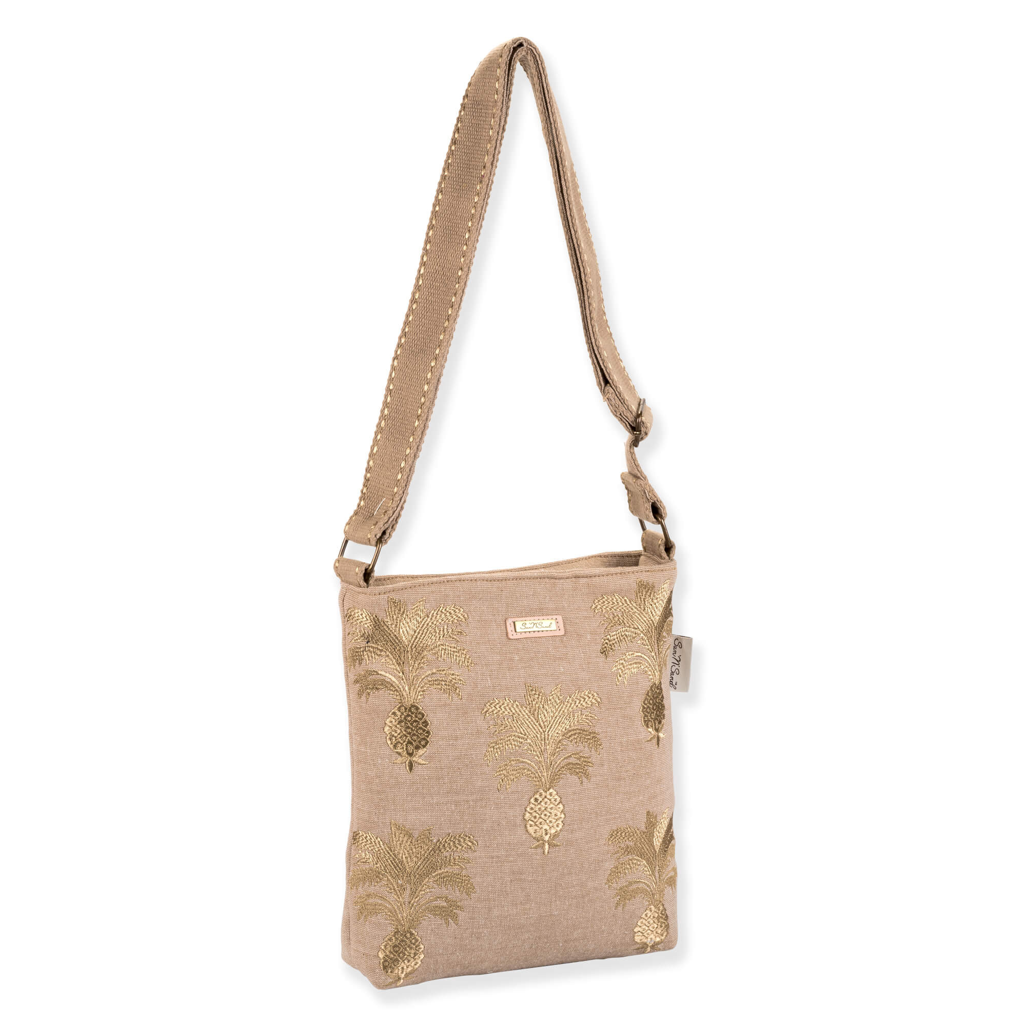 side view of a rectangular beige woven jute crossbody bag featuring gold embroidered pineapple graphics, an adjustable strap, and metal hardware.