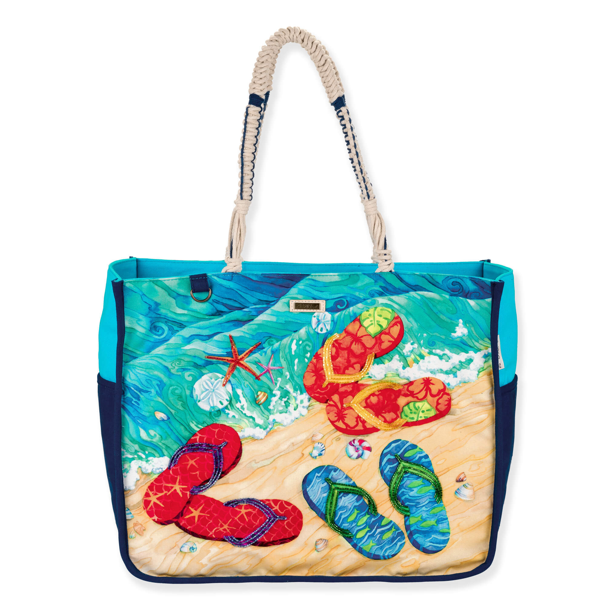front view of a rectangular canvas tote featuring colorful flip-flop beach graphics, braided rope handles, and silver metal hardware.