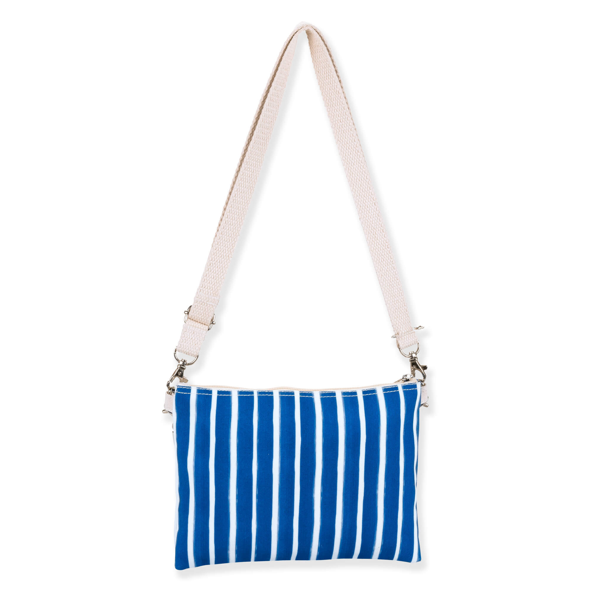 back view of a rectangular crossbody bag featuring a vibrant tropical leaf print, blue striped trim, and cream adjustable strap.