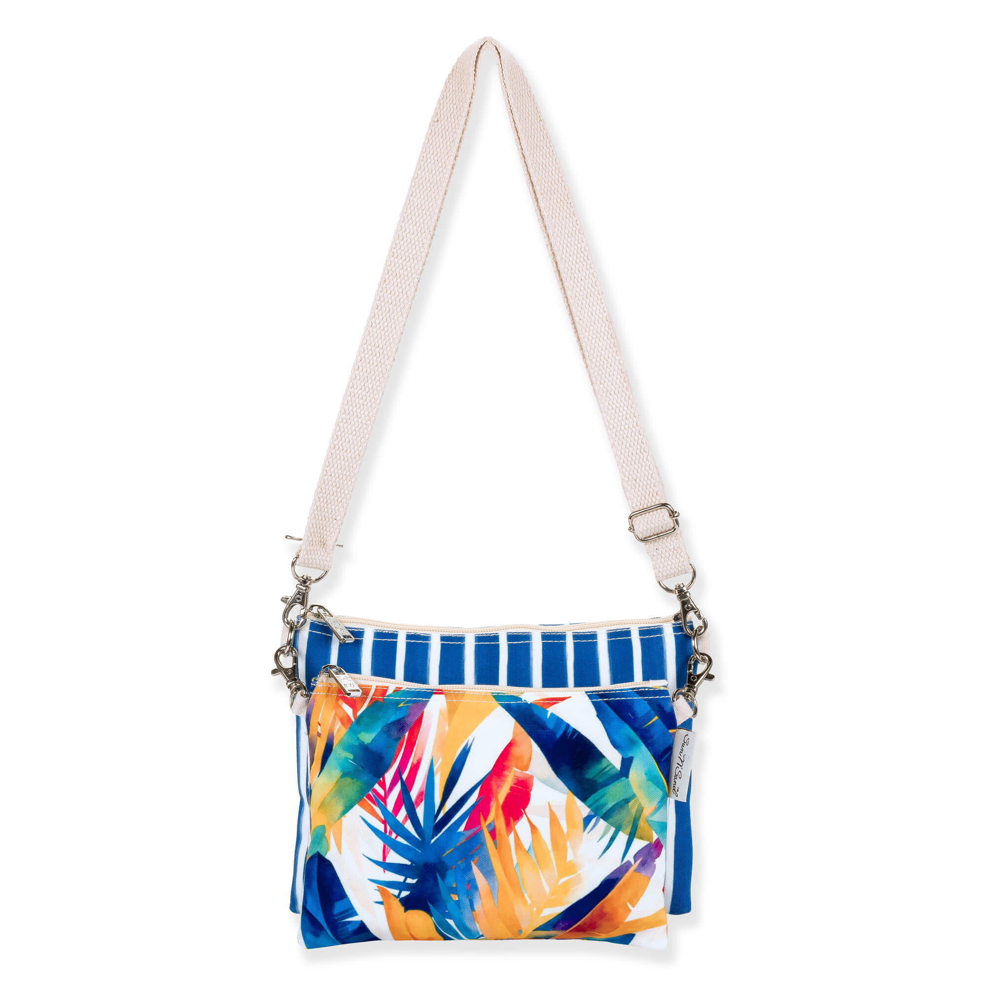 Front view of a rectangular crossbody bag featuring a vibrant tropical leaf print, blue striped trim, and cream adjustable strap.