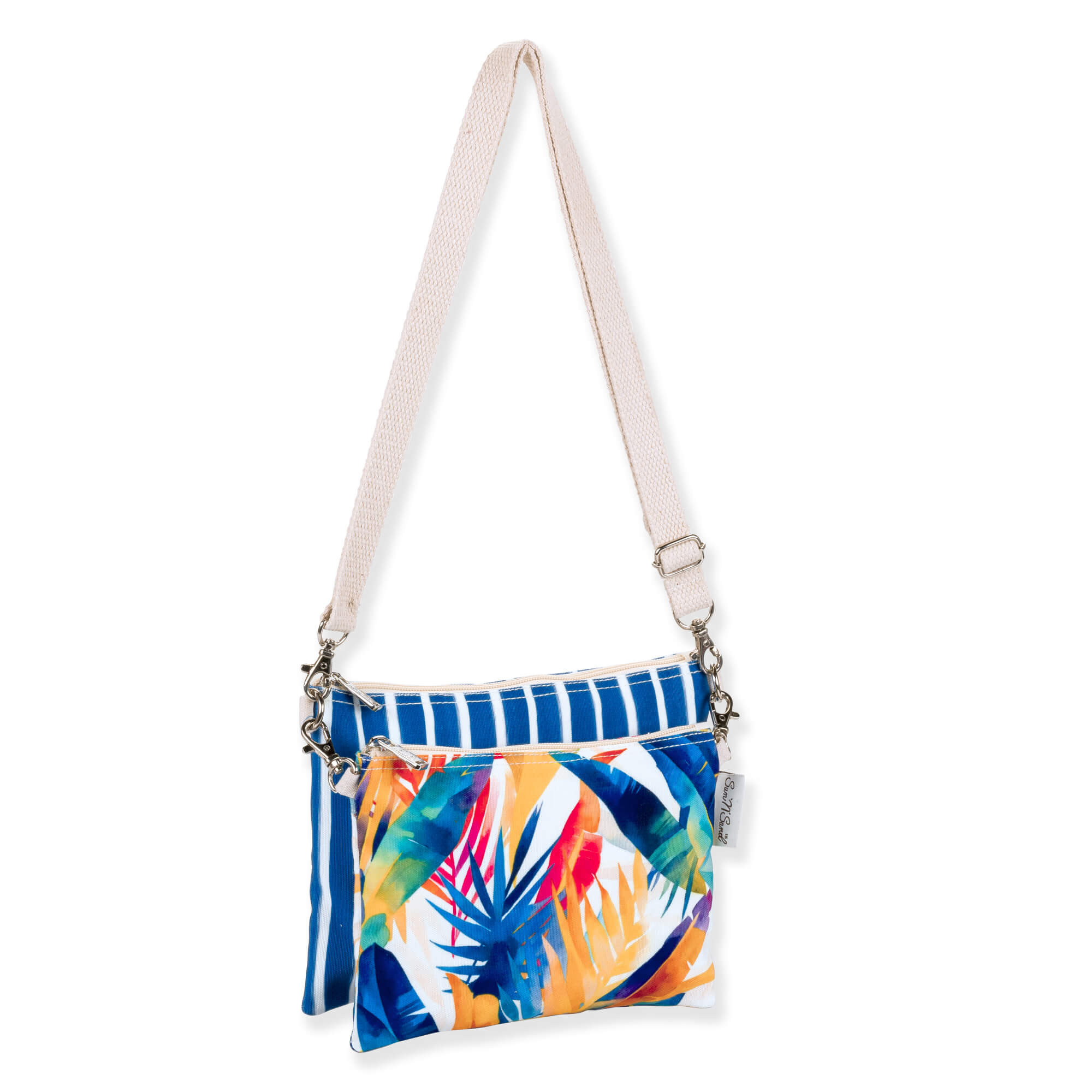 side view of a rectangular crossbody bag featuring a vibrant tropical leaf print, blue striped trim, and cream adjustable strap.
