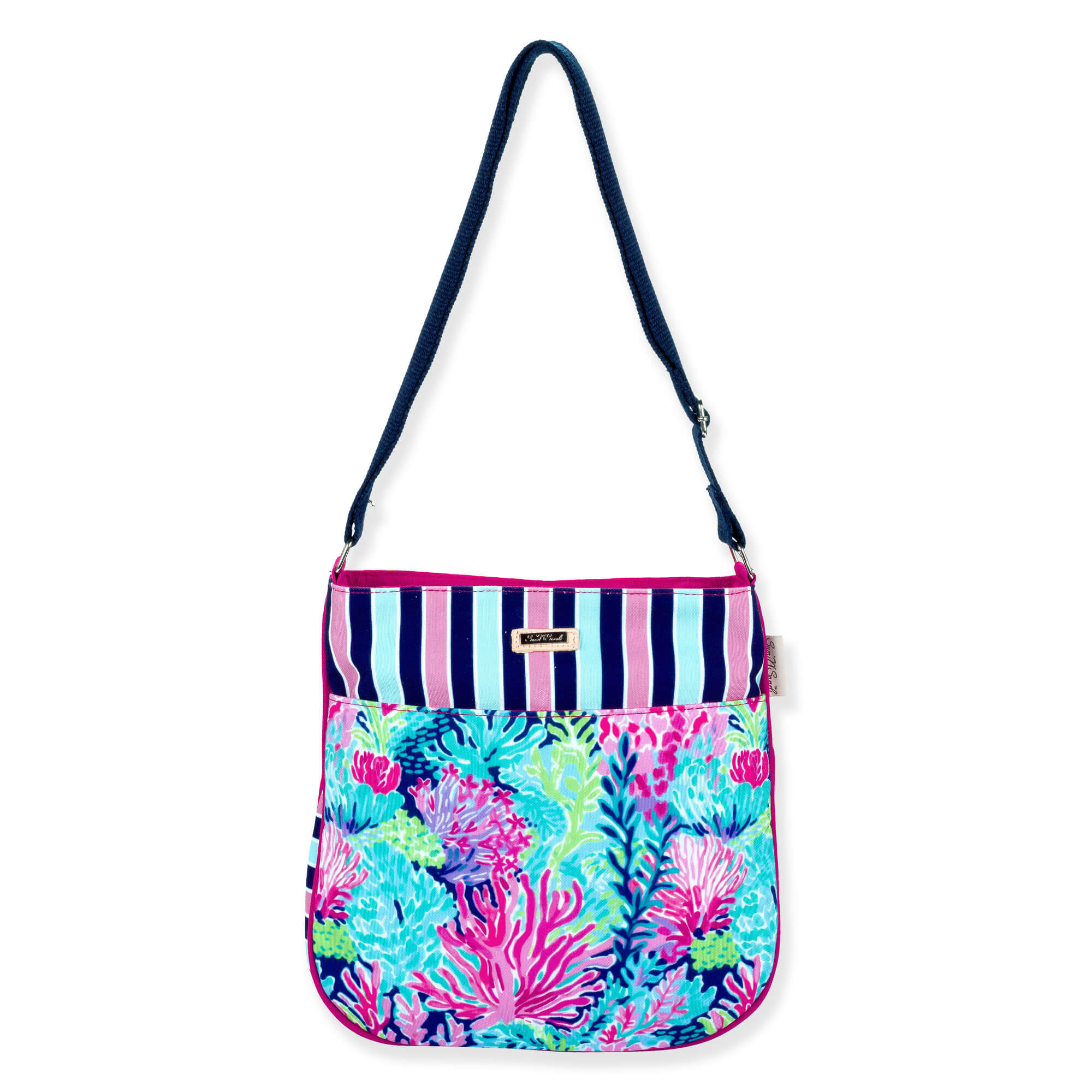 Front view of a rectangular crossbody bag featuring a vibrant coral reef print, pink striped trim, and navy adjustable strap.