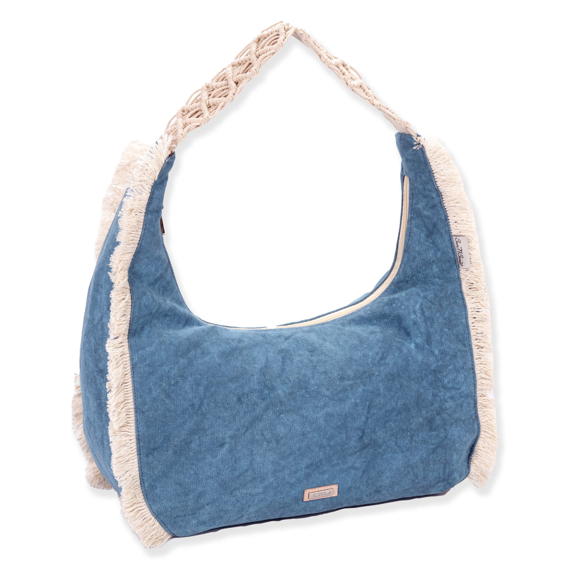 Three-quarter view of a crescent-shaped blue fabric hobo bag featuring vertical cream fringe trim and a braided macramé shoulder strap.