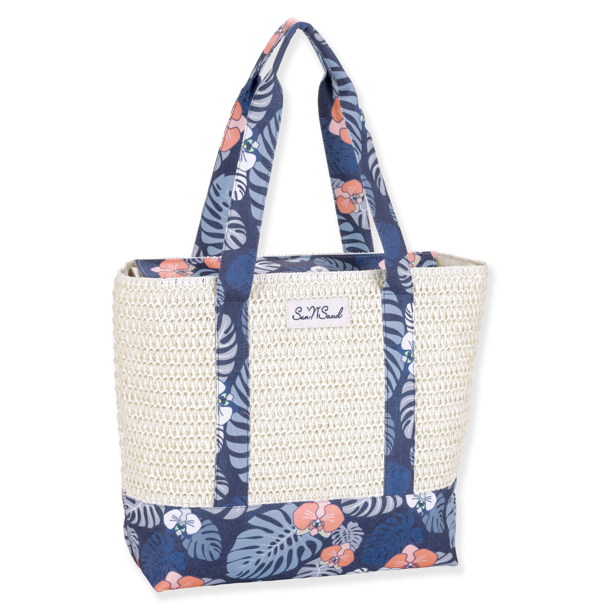 Side view of cream woven straw Sun N Sand tote featuring blue tropical monstera leaf canvas trim and matching straps.