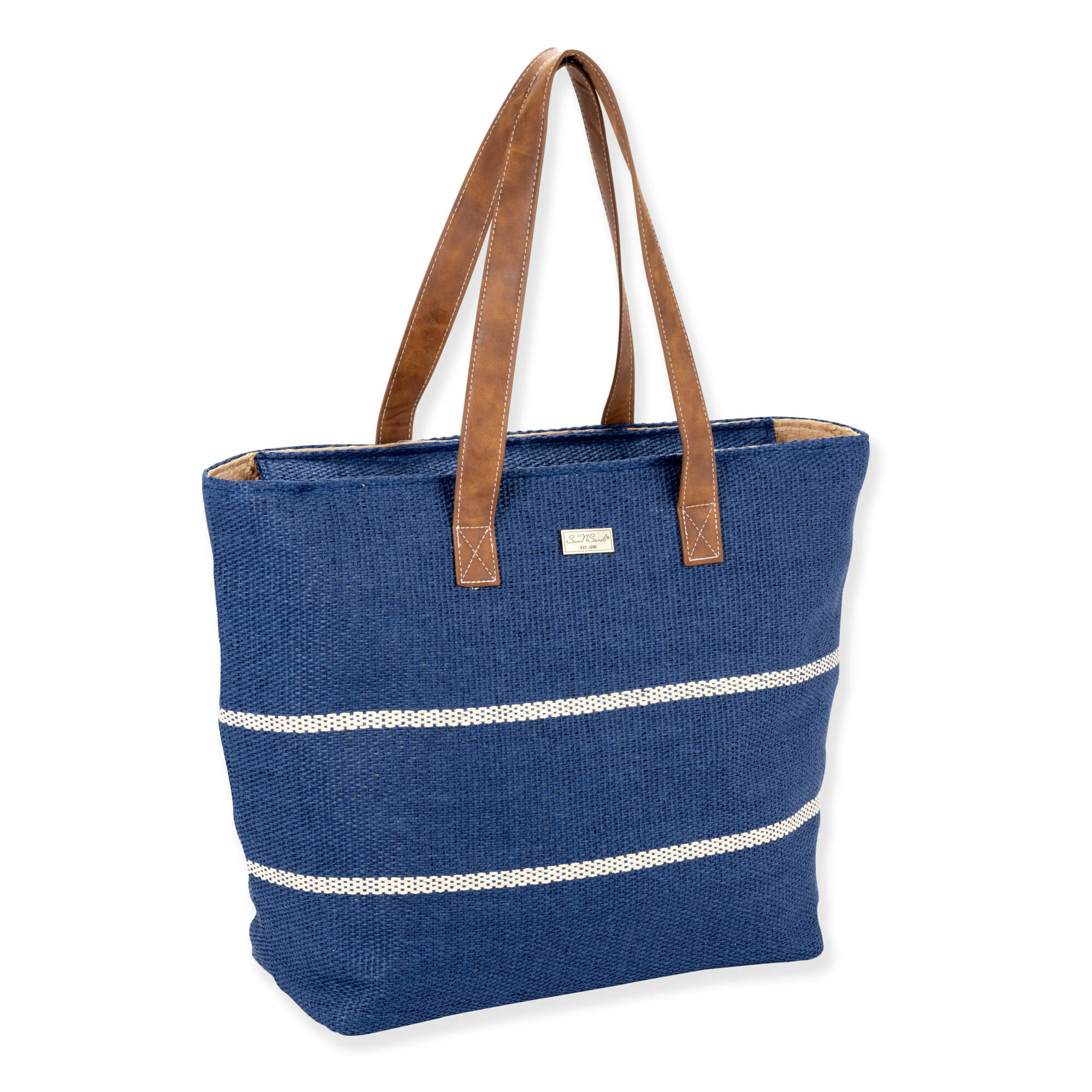 three quarters  view of Sun 'N' Sand navy burlap tote, white horizontal stripes, brown faux leather shoulder straps, and metal logo plate.