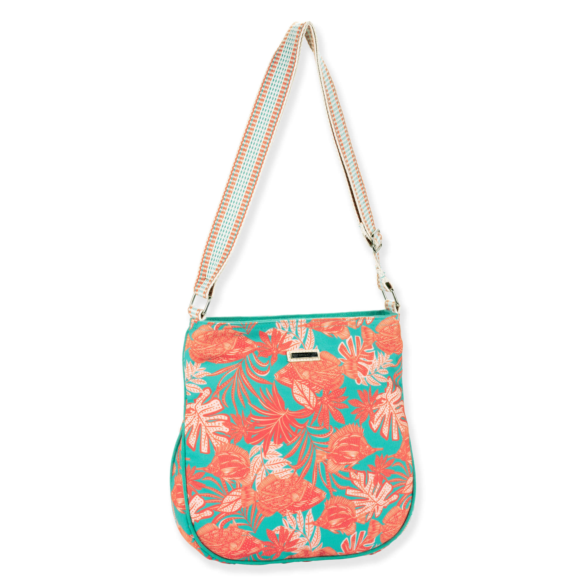 Three-quarter front view of Caribbean Joe CJ8928 teal crossbody bag, orange tropical print, striped webbing strap, and silver metal hardware.