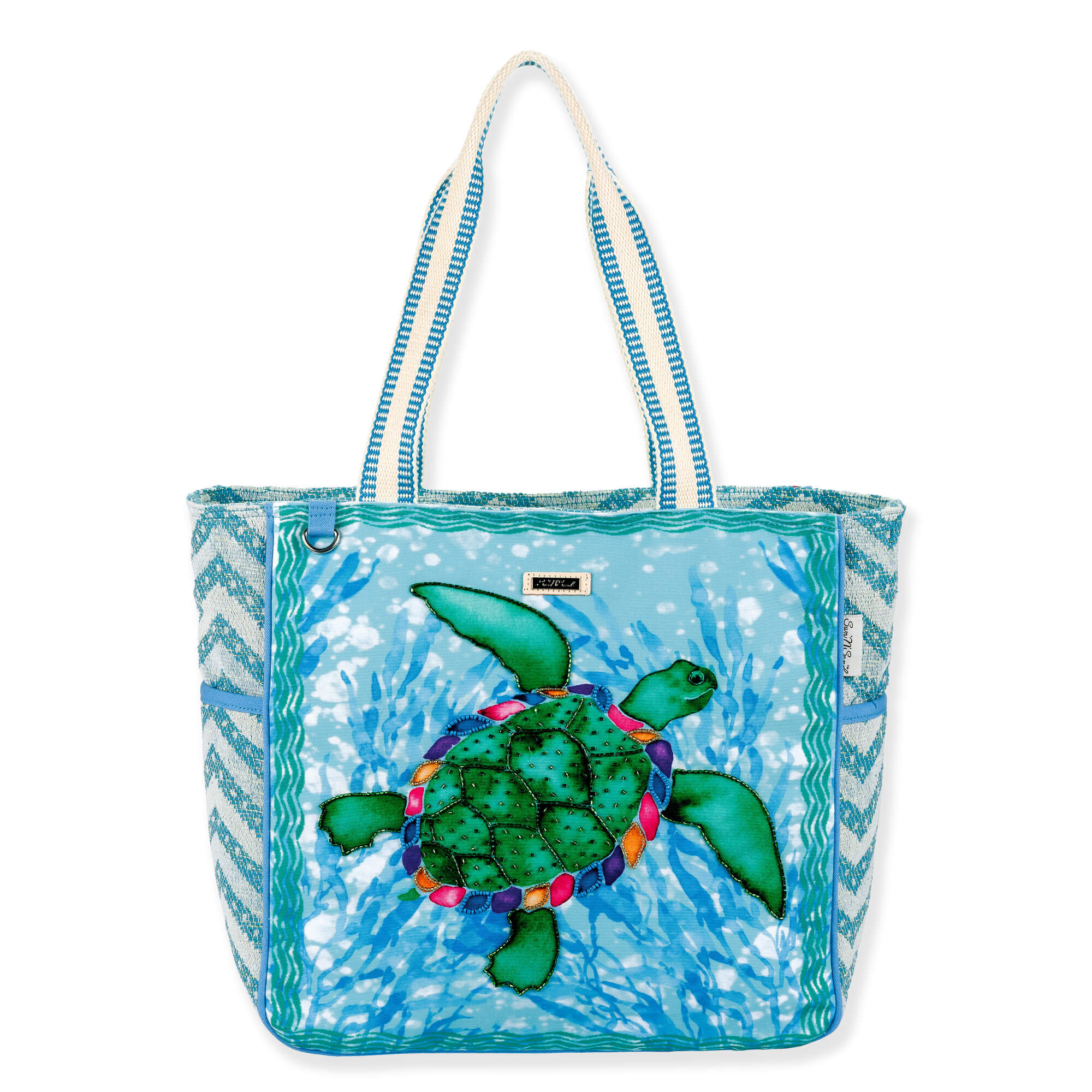 Three-quarter view of teal Sun 'N' Sand Paul Brent Sea Turtle shoulder tote with beaded applique, chevron-woven sides, and striped straps.