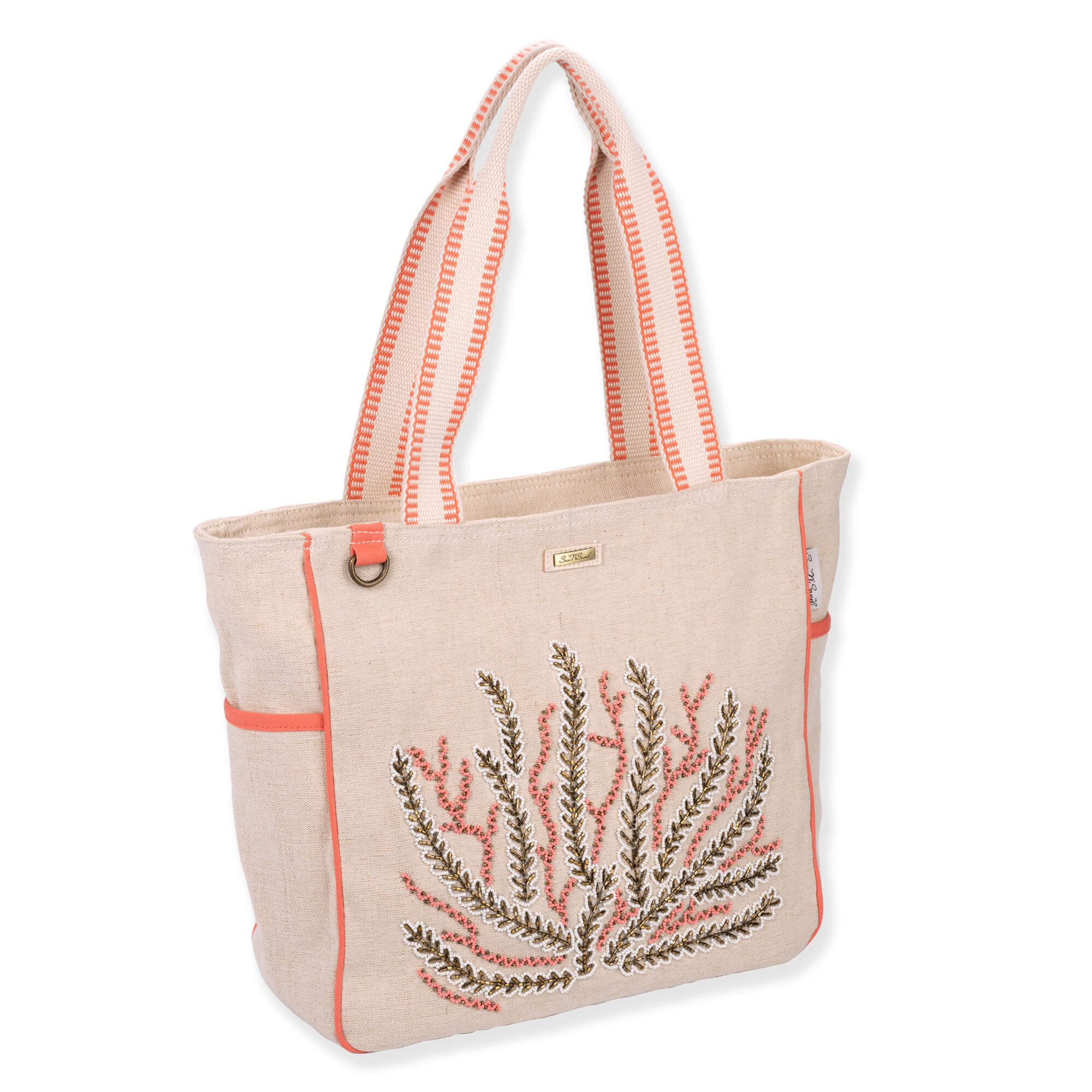 Three-quarter view of beige Sun 'N' Sand Beaded Coral shoulder tote featuring woven canvas texture, coral beaded applique, and metal D-ring