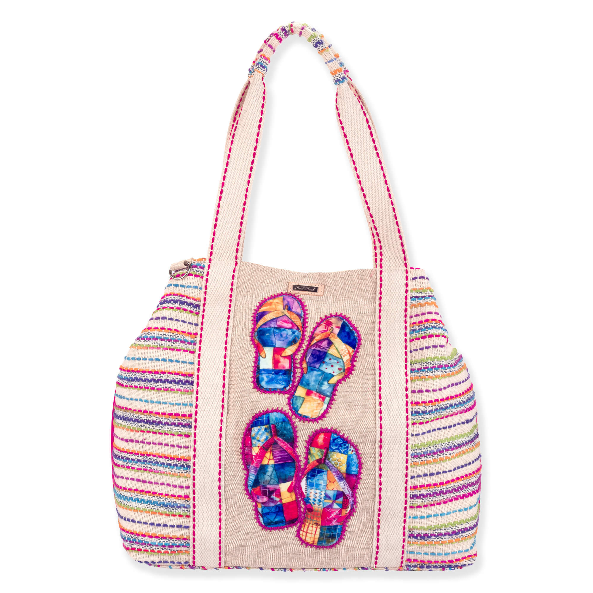 Front view of beige Sun 'N' Sand canvas tote featuring multi-color flip-flop appliques, striped woven panels, and pink-stitched straps.