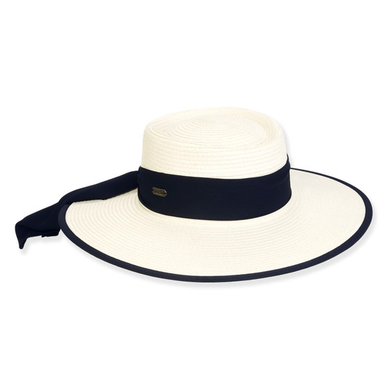 Three-quarter view of a white woven straw boater hat featuring a wide navy blue ribbon band and a matching navy-edged brim.
