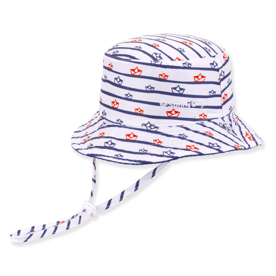 Three-quarter view of a white bucket hat featuring blue horizontal stripes, red fish prints, and an adjustable striped chin strap.