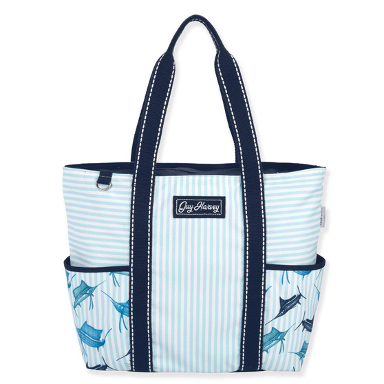 Front view of a rectangular blue striped tote featuring marlin graphics, side pockets, navy canvas handles, and silver metal hardware.
