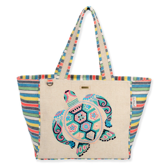 Front view of a rectangular beige tote bag featuring a colorful embroidered sea turtle, striped side panels, and metal hardware.