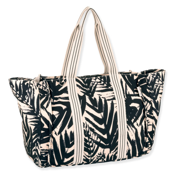 side view of a rectangular navy crossbody bag featuring a white tropical leaf print, front zipper pocket, and silver logo hardware.
