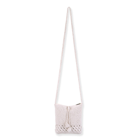 Front view of cream crochet Sun N Sand crossbody bag featuring floral open-work hem, drawstring tassels, and braided shoulder strap.