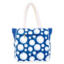 Navy blue canvas beach tote bag with white seashell dot pattern, rope handles, textured fabric panels, soft rectangular shape, back view shown