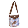 Light blue crossbody bag with illustrated sea turtle motif, curved flap pocket, zippered opening, adjustable brown shoulder strap, angled side view