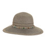 Front angled view of women’s natural woven wide brim sun hat with textured pattern, beaded earth tone band, and small metallic logo tag around crown.