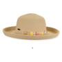 Front-view studio shot of tan woven Sun N Sand upbrim hat featuring colorful flat beads, metal logo plaque and texture.
