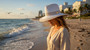 Lifestyle portrait of the Sun N Sand HH3505 Women’s Safari Hat in natural-toned woven straw, featuring a decorative braided rope hatband and a structured crown for an adjustable fit and UPF 50+ sun protection.