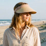 Lifestyle portrait of the Sun N Sand HH3544 Women’s Visor in a natural woven straw, featuring a tan fabric-covered clip-on headband and a wide, curved brim for easy wear and UPF 50+ sun protection.