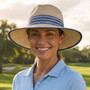 Lifestyle portrait of the Sun N Sand HH3494 Women’s Safari Hat in white woven straw, featuring a decorative open-weave crown and a wide, scalloped-edge brim for an adjustable fit and UPF 50+ sun protection.