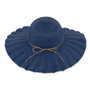 Navy woven floppy hat with scalloped brim, concentric stitching, tan decorative string, small metallic side emblem, shown in clear front angled view.