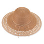 Three-quarter profile view of a black and tan woven straw floppy hat featuring a rounded crown, rope trim, and metal logo.