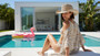 Lifestyle profile portrait of the Sun N Sand HH3638 Women’s Western Hat in a natural woven straw, featuring a decorative metallic beaded hatband and a wide, upturned cowboy-style brim with a structured crown for an adjustable fit and UPF 50+ sun protection.