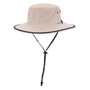 Three-quarter view of a cream performance bucket hat featuring a flat crown, navy-trimmed brim, side ventilation eyelets, and adjustable chin-strap.