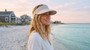 Lifestyle profile portrait of the Sun N Sand HH3549 Women’s Visor in a light gray linen-textured fabric, featuring a matching adjustable elastic band and a wide, structured brim for a comfortable, stay-put fit and UPF 50+ sun protection.