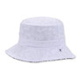 Three-quarter view of a light blue acid-wash denim bucket hat featuring a flat crown, wide floppy brim, and small metal grommet.