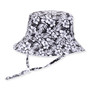 Three-quarter view of a black and white tropical floral print bucket hat featuring hibiscus flowers and an adjustable chin strap.