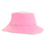 Side view of a soft pink terry cloth bucket hat featuring a downward-sloping brim and a small gold metal logo-plate.